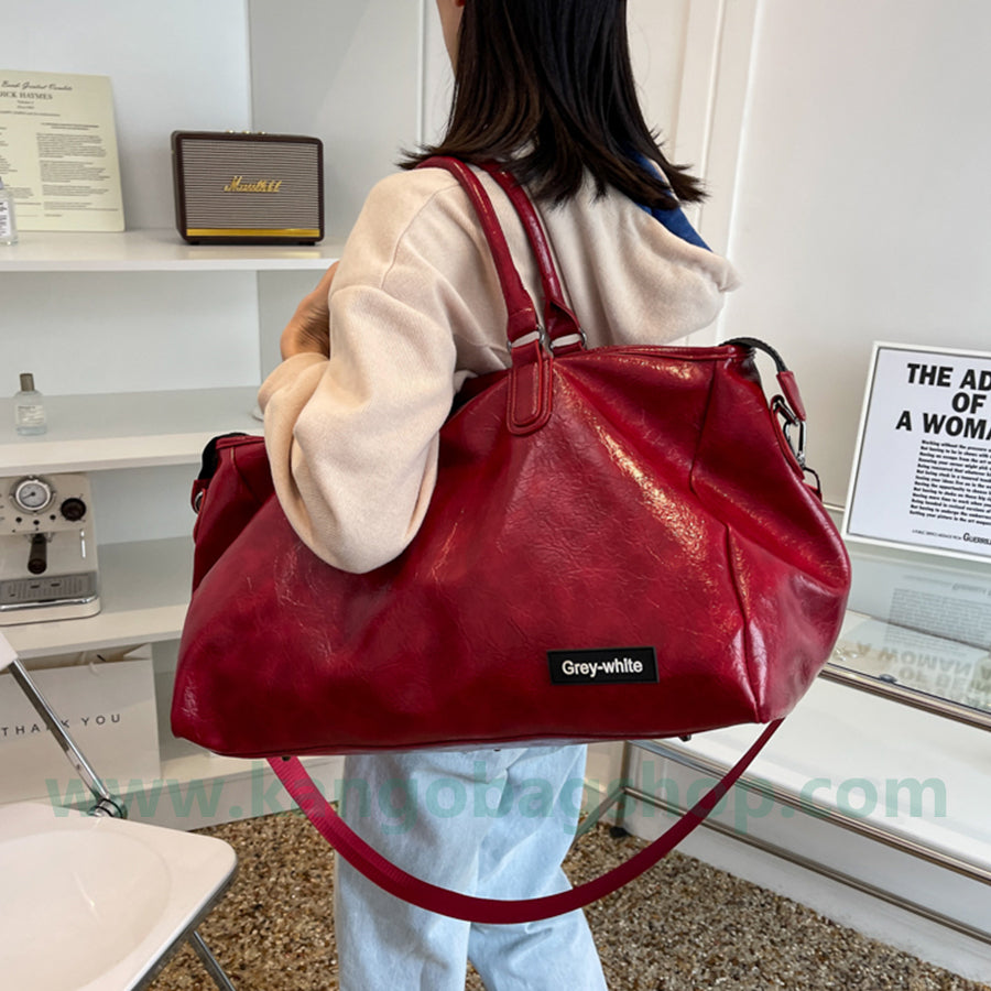 Travel bag female portable luggage leather large-capacity portable sports fitness bag travel bag